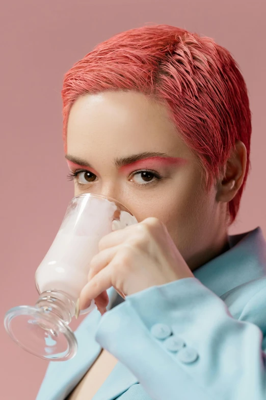 a woman with pink hair drinking from a glass, an album cover, inspired by Pearl Frush, trending on pexels, ana de la reguera portrait, skincare, colored milk tea, close up portrait photo