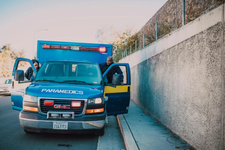 a blue ambulance parked on the side of a road, a photo, by Ryan Pancoast, pexels, happening, people at work, bay area, 15081959 21121991 01012000 4k, panoramic shot