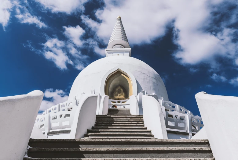 a large white building with steps leading up to it, unsplash contest winner, sri lanka, dome of wonders, blue sky, buddhist art