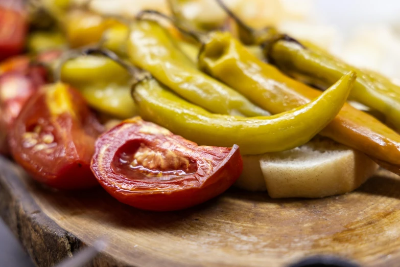 a wooden cutting board topped with sliced vegetables, by Sam Dillemans, unsplash, renaissance, turkey, pickle, background image, costa blanca