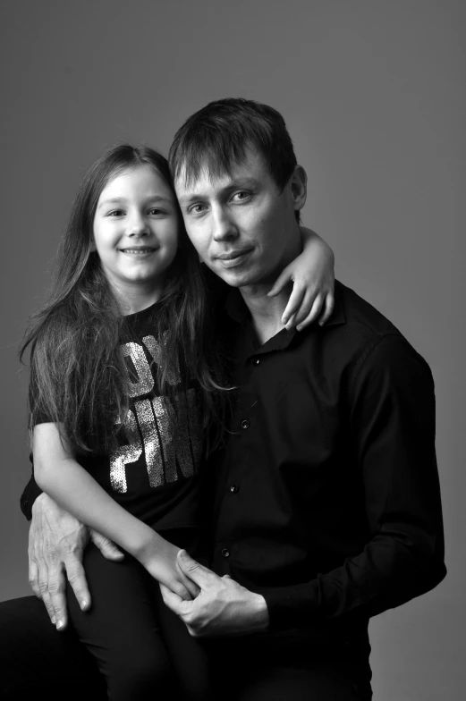 a man and woman posing for a black and white photo, inspired by Aleksandr Gerasimov, with a kid, studio!! portrait lighting, greta thunberg, ((portrait))