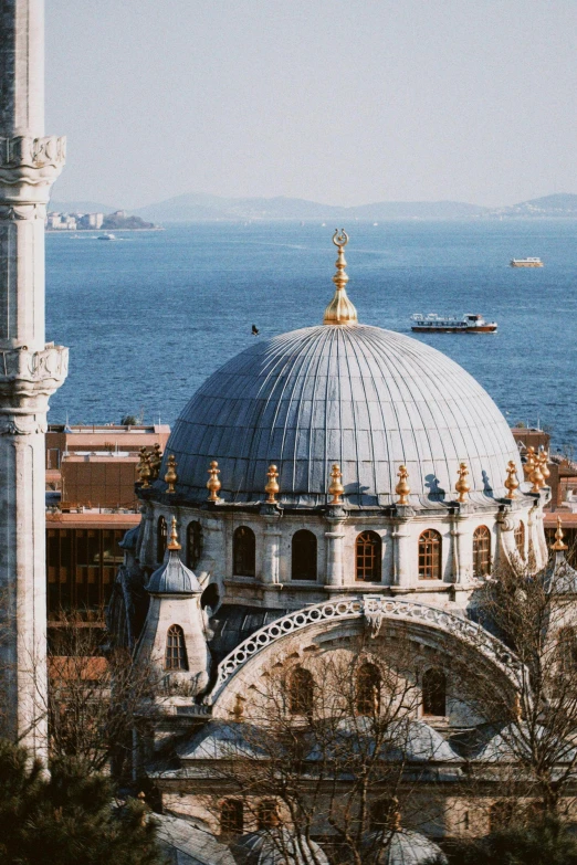 a large building next to a body of water, inspired by Altoon Sultan, renaissance, dome, seaview, exterior, roofs