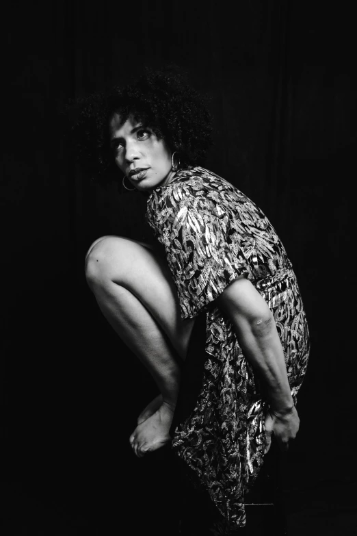 a black and white photo of a woman squatting, by Clifford Ross, zack de la rocha, genderless, ((portrait)), drag