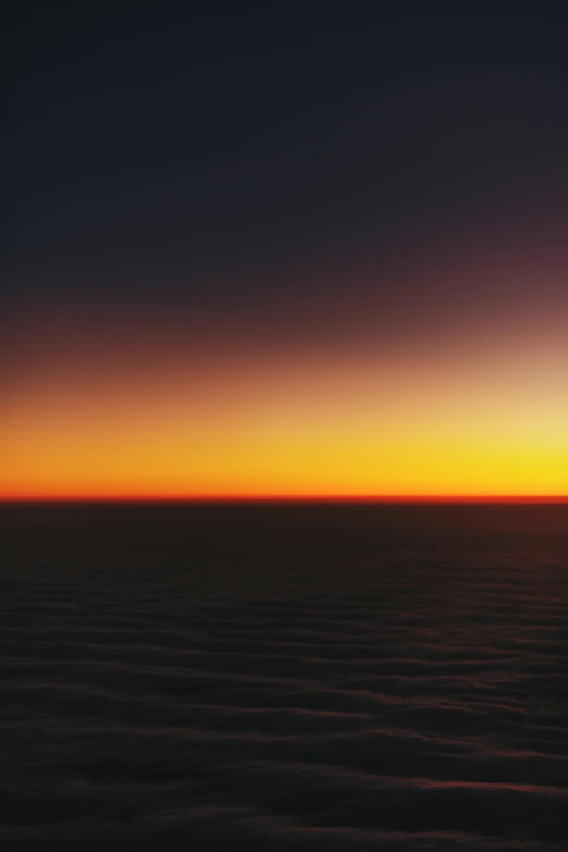 the sun sets over the ocean as seen from an airplane, inspired by Jan Rustem, romanticism, joel meyerowitz, daniel richter, 2070, night colors