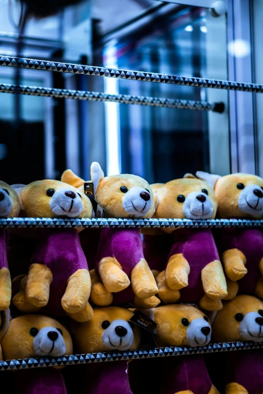 a bunch of teddy bears sitting next to each other, in an elevator, arcade game, shot with sony alpha, purple and yellow