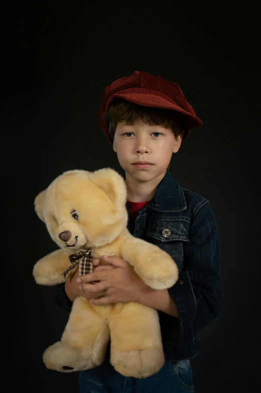 a young boy is holding a teddy bear, a picture, inspired by August Sander, pexels, visual art, character with a hat, frown fashion model, with professional lighting, a handsome
