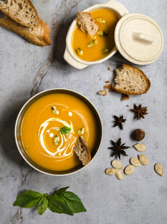 a bowl of soup sitting on top of a table, product image, pumpkin, multi-part, mint