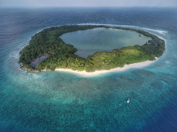 a small island in the middle of the ocean, by Daren Bader, pexels contest winner, hurufiyya, lush surroundings, luxury, nat geo, mami wata