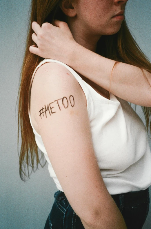 a woman with a tattoo on her arm, hashtags, bullying, promo image, labels