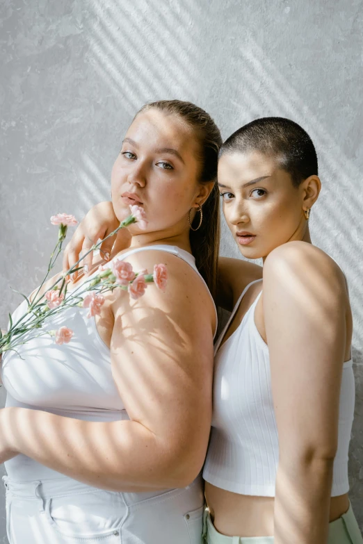 two women standing next to each other holding flowers, inspired by Wang Duo, trending on pexels, renaissance, buzz cut hair, portrait sophie mudd, curves, white clothing