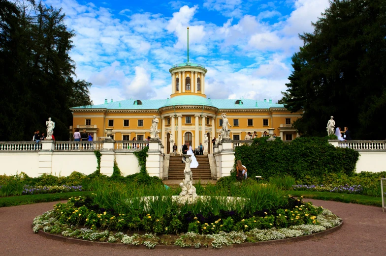 a large building with a fountain in front of it, an album cover, pixabay, neoclassicism, shishkin, lush surroundings, a tiara with emeralds, finland