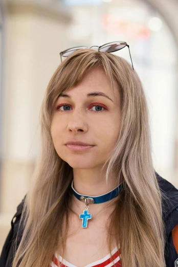 a woman wearing a necklace with a cross on it, inspired by Julia Pishtar, trending on reddit, bleached, asuka, discord profile picture, high resolution photo