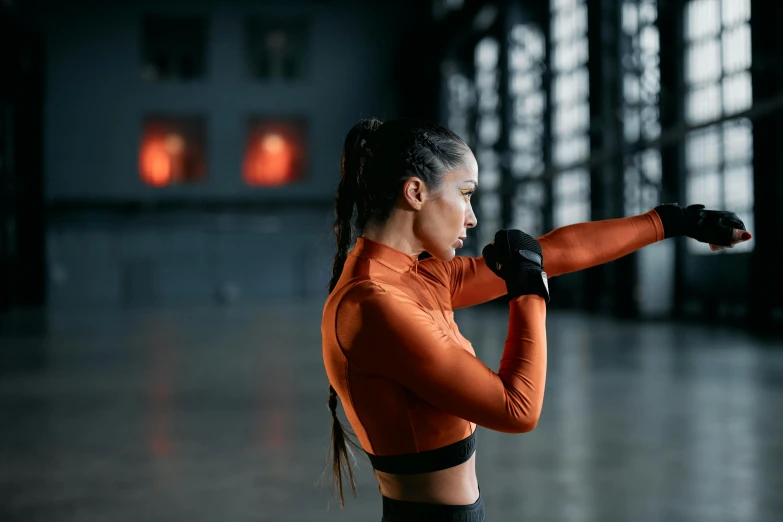 a woman in an orange top and black leggings, pexels contest winner, working out, bella poarch, fight, inspect in inventory image