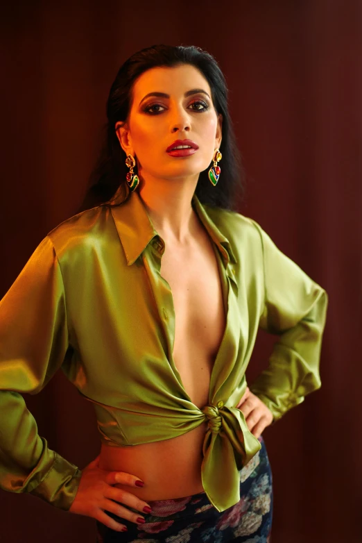 a woman in a green shirt posing for a picture, an album cover, trending on pexels, renaissance, indian super model, lady dimitrescu, open shirt, low iso