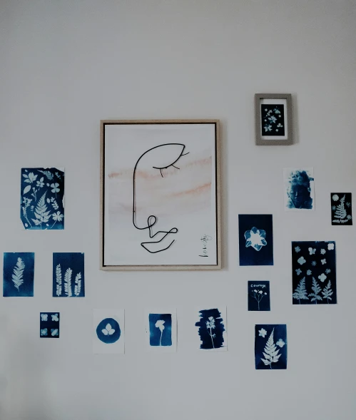 a bed room with a neatly made bed and a picture on the wall, by Andrée Ruellan, pexels contest winner, modern european ink painting, blue faces, paper cut out, face doodles, dark blue tones