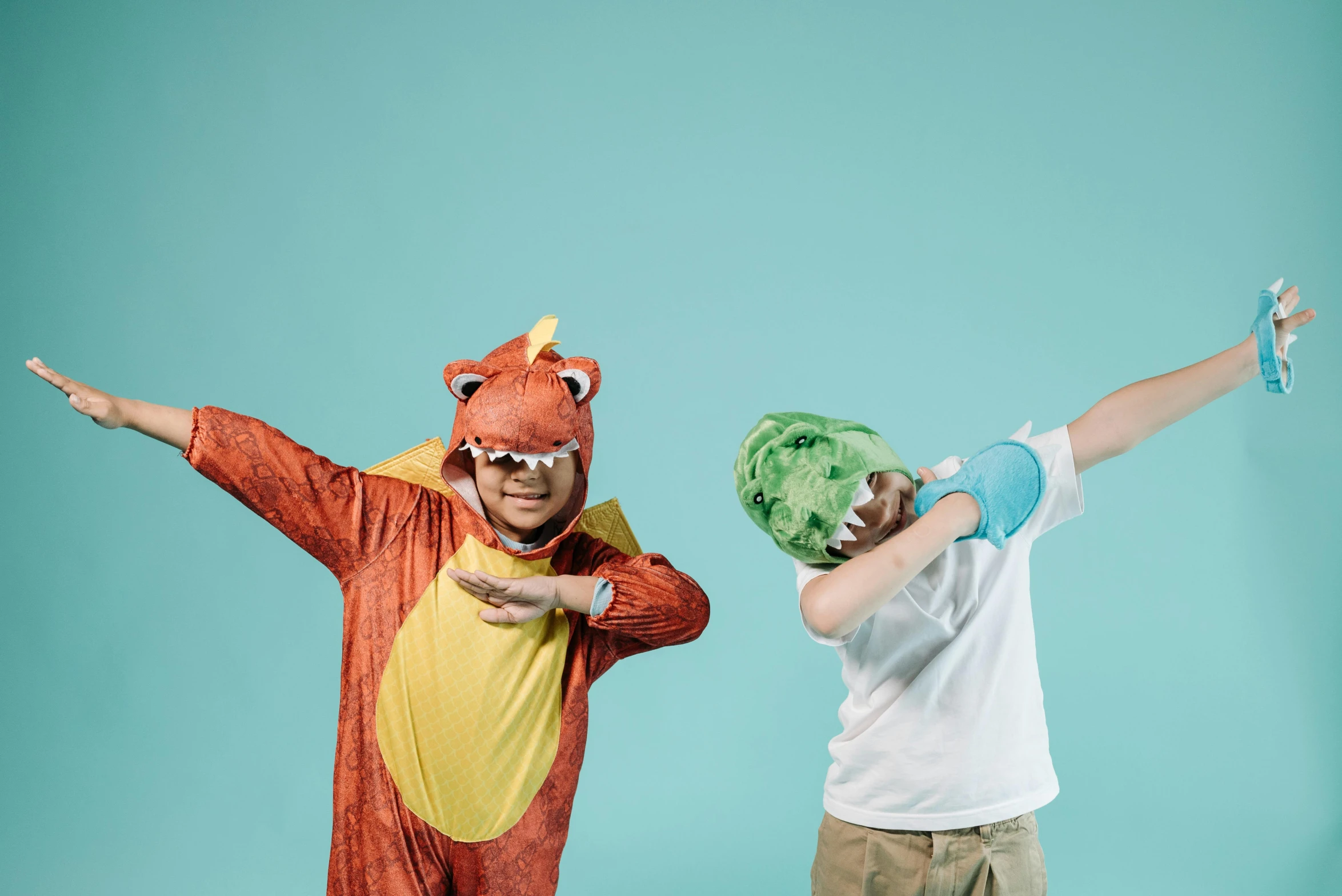 a couple of people in costume standing next to each other, inspired by Abidin Dino, trending on pexels, kids playing, fighting each other, jamie hewlet, educational