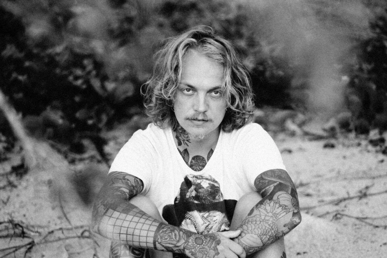 a black and white photo of a man with tattoos, douglas smith, samma van klaarbergen, lizard king / queen forgiveing, lowres