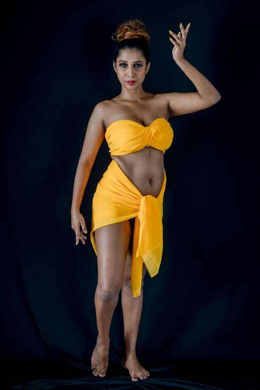 a woman in a yellow dress posing for a picture, by Sven Erixson, art photography, attire: bikini, african queen, studio photography portrait, taken in 2022