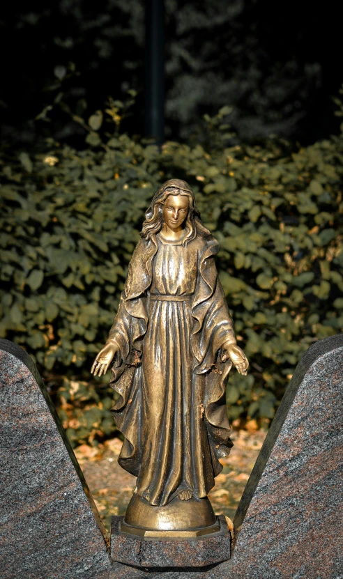 a statue of a woman standing on top of a grave, grotto, 15081959 21121991 01012000 4k, portrait of virgin mary, made of bronze