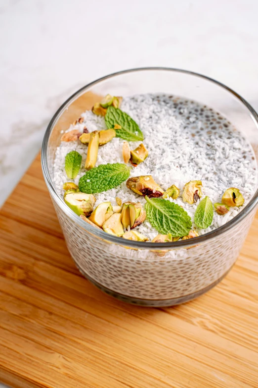 a bowl of chia pudding on a cutting board, by Julia Pishtar, hurufiyya, moroccan, mint, malaysian, 5k