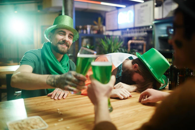 a group of people celebrating st patrick's day at a bar, a photo, shutterstock, wearing green clothing, hungover, aussie baristas, instagram photo