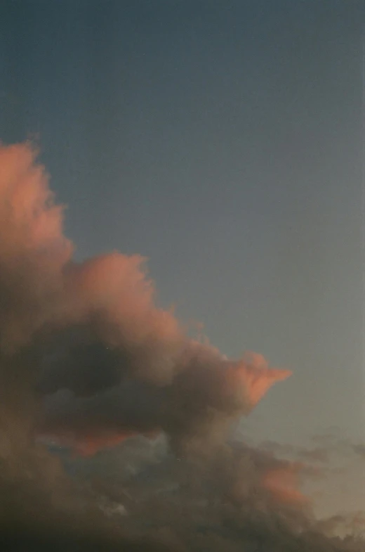 a large jetliner flying through a cloudy sky, a picture, by Friedel Dzubas, conceptual art, pink sunset, todd hido, mane, bald