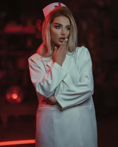 a woman dressed as a nurse smoking a cigarette, inspired by Elsa Bleda, trending on pexels, platinum blonde, soft devil queen madison beer, wearing lab coat, non binary model