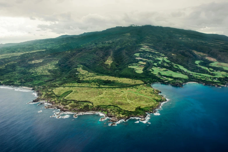 an aerial view of a lush green island, by Daniel Lieske, pexels contest winner, hurufiyya, maui, 2 5 6 x 2 5 6 pixels, aerial view of an ancient land, panels