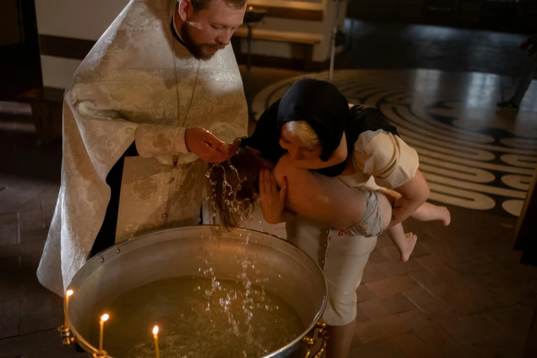 a couple of people that are standing in front of a pot, by Jakob Gauermann, pexels contest winner, renaissance, baptism, filling with water, 15081959 21121991 01012000 4k, russian
