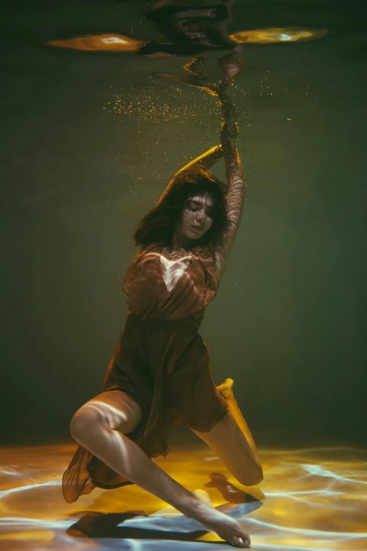 a woman that is in the water with a frisbee, an album cover, inspired by Elsa Bleda, unsplash, renaissance, classic dancer striking a pose, in a underwater horror scene, 4 k photo autochrome, performing on stage