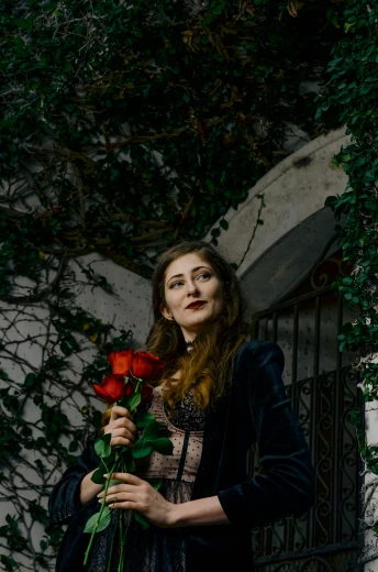 a woman standing in front of a building holding a rose, an album cover, by Alejandro Obregón, pexels contest winner, renaissance, carice van houten, draped in velvet and flowers, ((portrait)), hearts