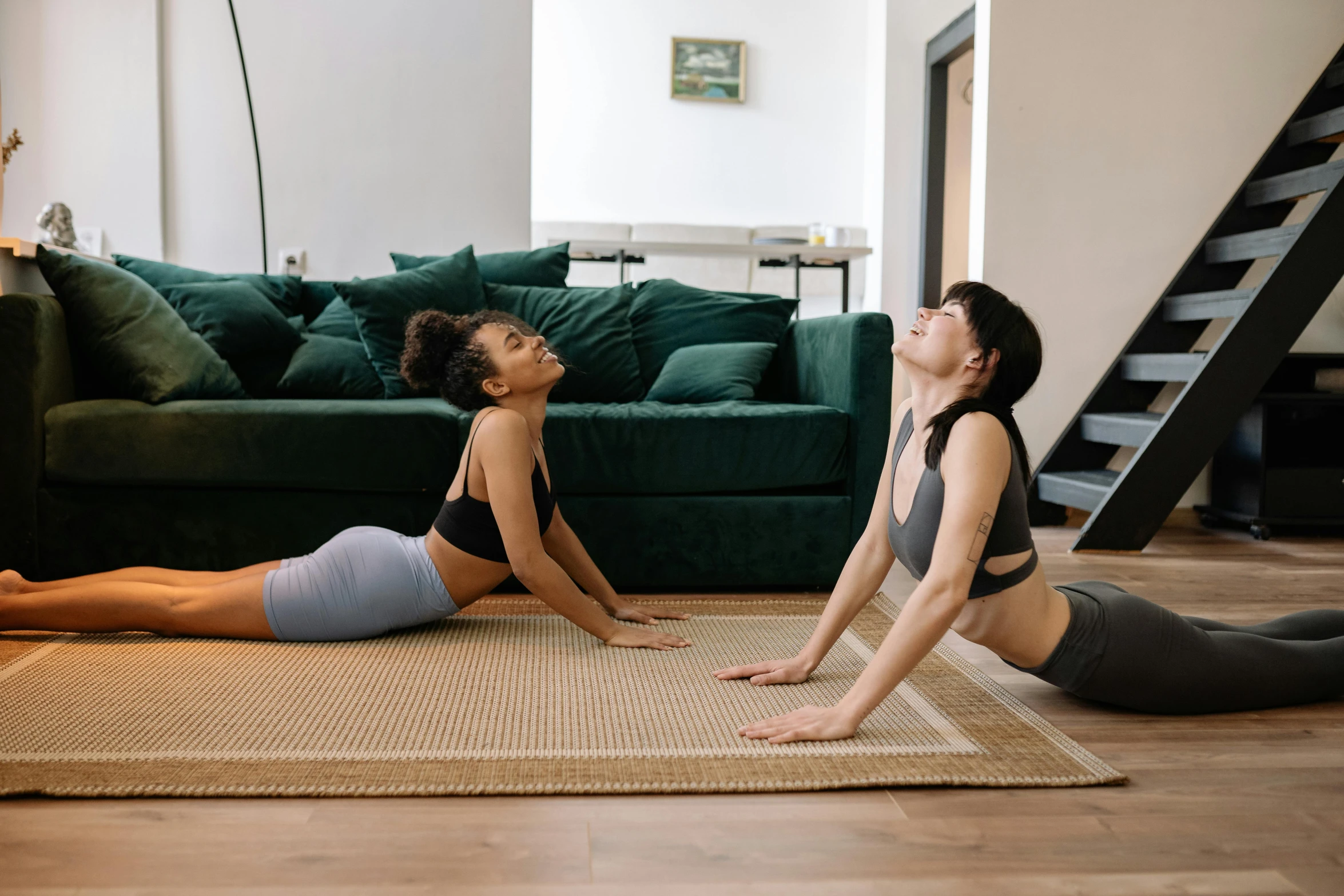 two women doing yoga in a living room, pexels contest winner, hurufiyya, green and brown clothes, sydney park, woman is curved, profile image