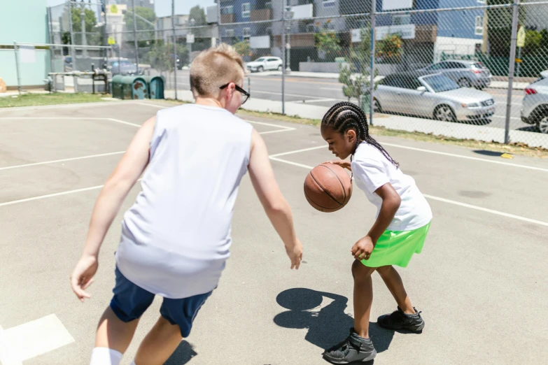 a couple of kids playing a game of basketball, lynn skordal, profile image, bay area, on center