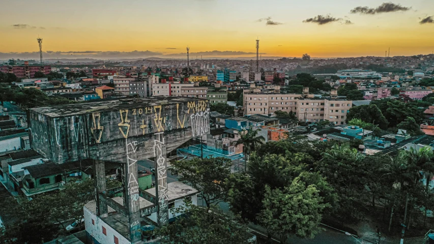 an aerial view of a city at sunset, a portrait, graffiti, cuban setting, 🦑 design, panorama, conde nast traveler photo