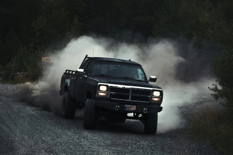 a black truck driving down a dirt road, smoke from mouth, profile picture 1024px, gen z, soft color dodge