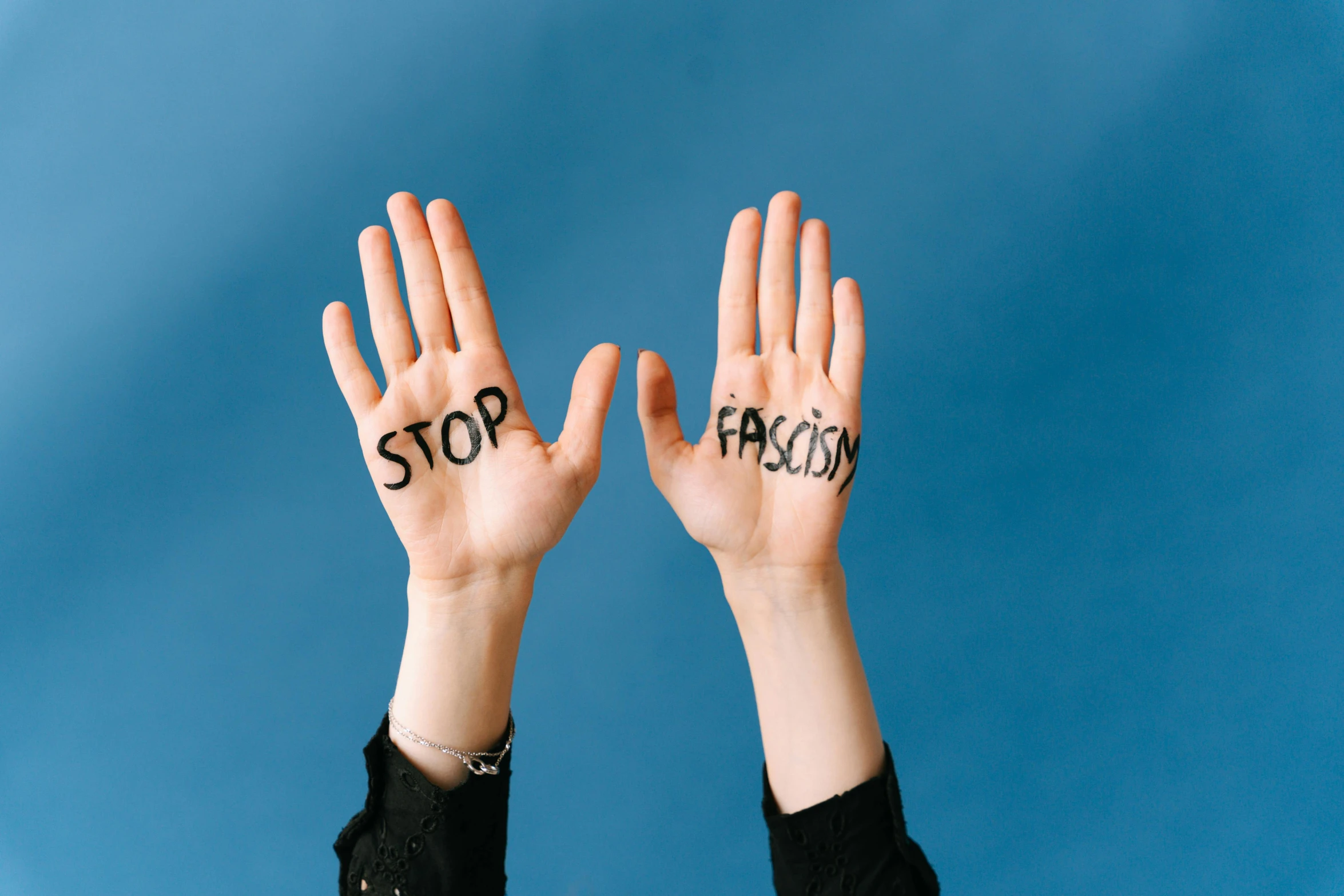 two hands with the word stop written on them, by Arabella Rankin, trending on pexels, excessivism, fascist, full faced, fusion, multi-part
