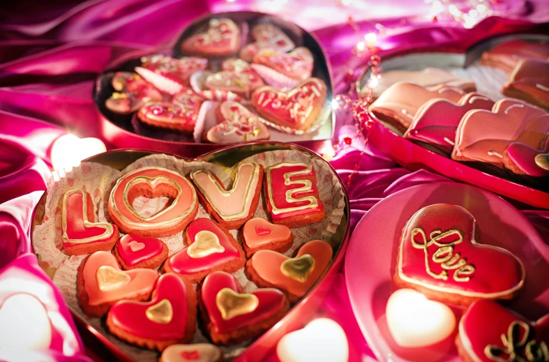 a table topped with lots of heart shaped cookies, by Julia Pishtar, dazzling lights, stockphoto, closeup - view, romantic lead