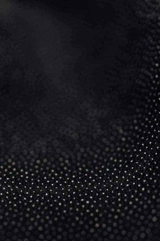 a black and white photo of a woman's face, a stipple, by Ross Bleckner, unsplash, kinetic pointillism, detail shot, black leather garment, seamless micro detail, vinyl material