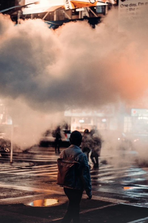 a group of people walking across a street, by Niko Henrichon, pexels contest winner, happening, police sirens in smoke, post apocalyptic new york, obscured hooded person walking, people facing fire circle