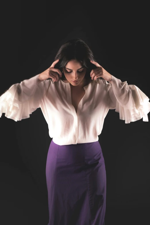 a woman in a white shirt and purple skirt, an album cover, inspired by Ramon Pichot, pexels, mila kunis, ( low key light ), voluminous sleeves, marvelous designer