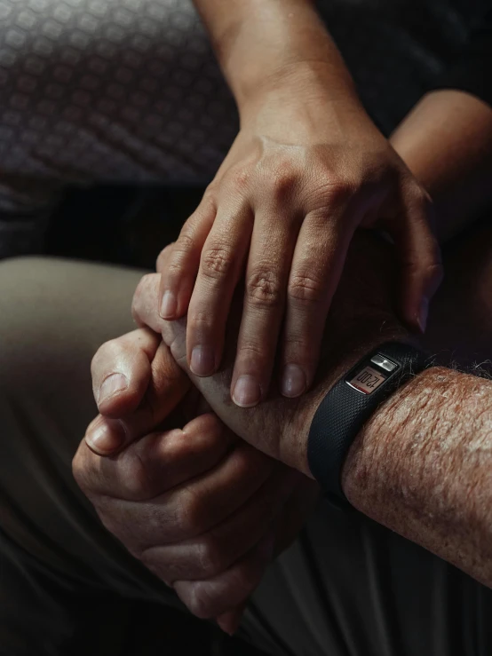 a close up of two people holding hands, by Dan Frazier, cinematic image, grandfatherly, bandage on arms, lgbtq