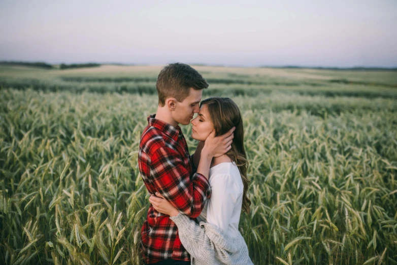 a couple kissing in a field of wheat, pexels contest winner, wearing a flannel shirt, slight stubble, quiet beauty, confident looking