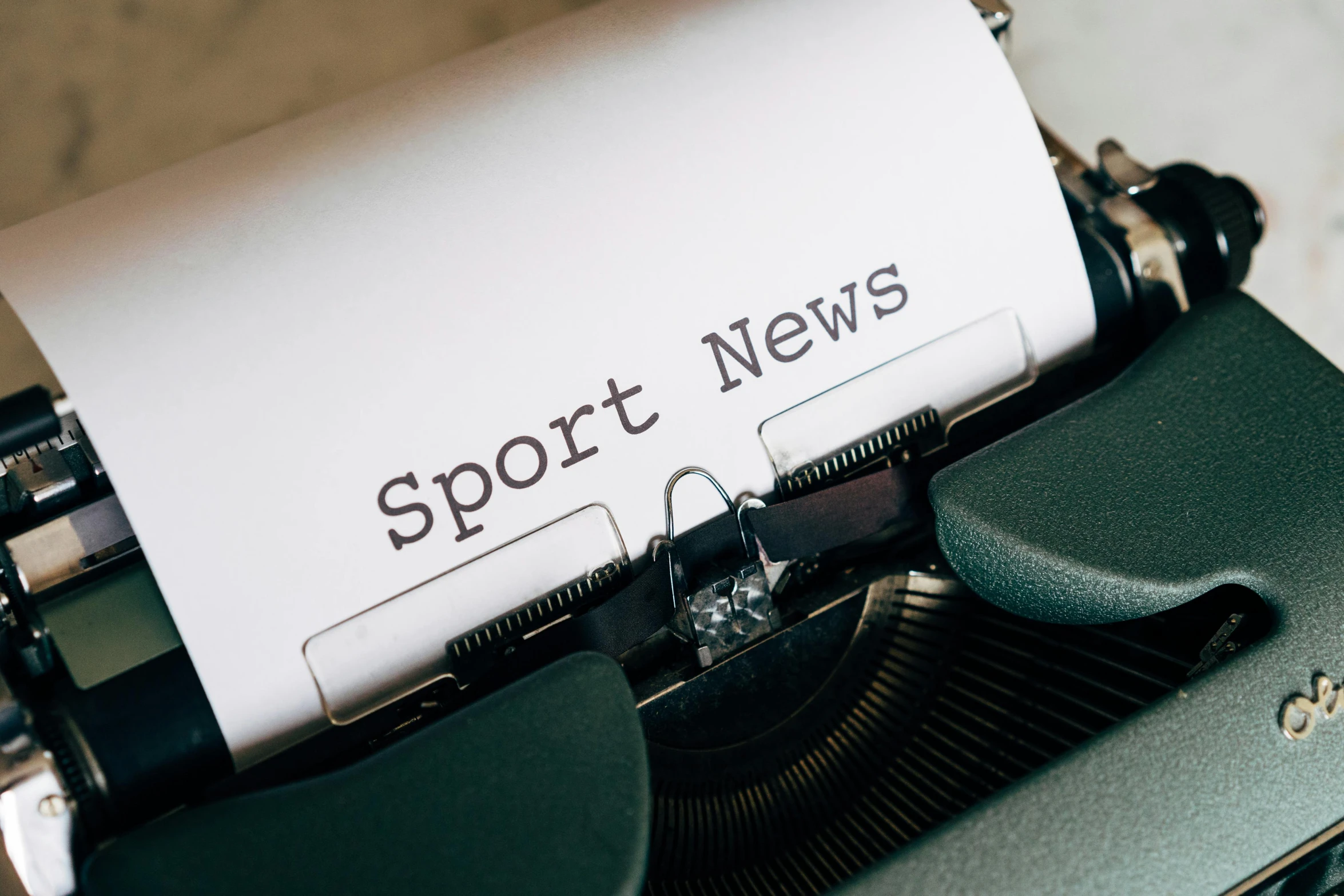 a close up of a typewriter with a paper on it, by Sebastian Spreng, sports logo, news, thumbnail, new