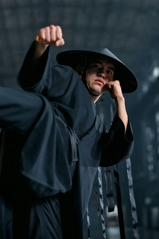 a man in a black robe and a black hat, an album cover, inspired by Liao Chi-chun, pexels contest winner, battle action pose, [ theatrical ], slide show, avatar image