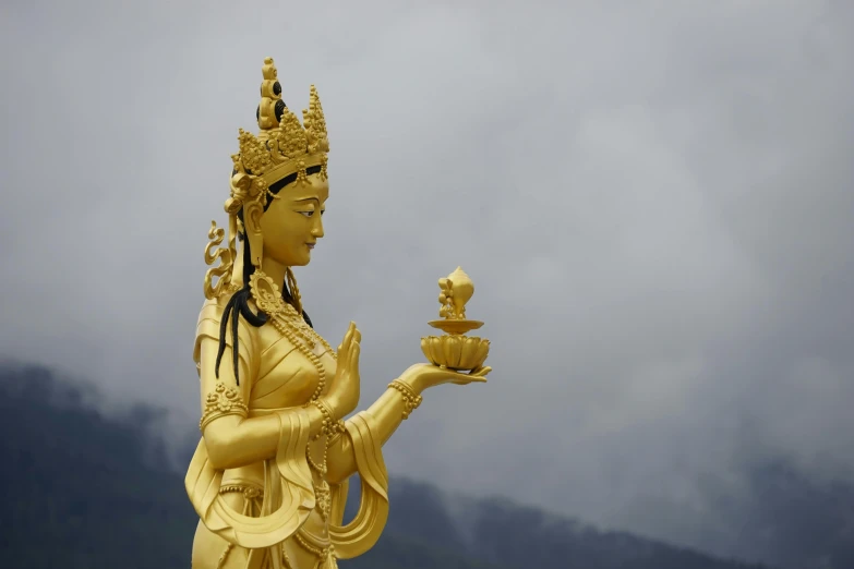 a statue of a woman holding a bowl, a statue, by Carey Morris, pexels contest winner, bhutan, wearing a golden crown, square, avatar image