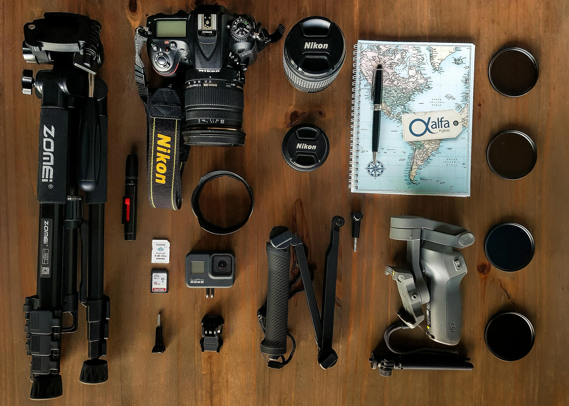 the contents of a camera laid out on a table, by Carey Morris, explore, portrait 8 k, tourist destination, gearing up for battle