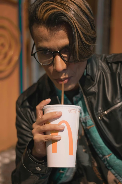 a man drinking a drink out of a paper cup, an album cover, photorealism, wearing thin large round glasses, an epic non - binary model, now at mcdonalds, alejandro