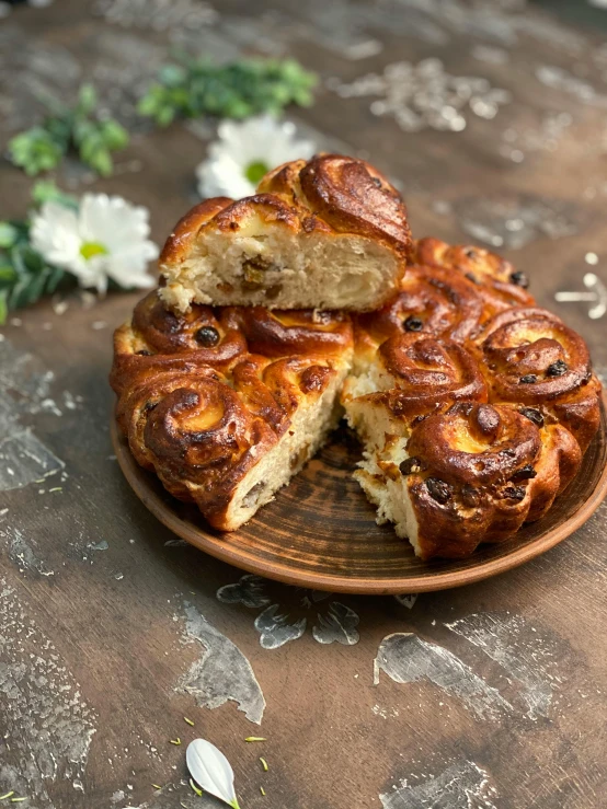 a close up of a plate of food on a table, inspired by Károly Markó the Elder, shutterstock contest winner, hurufiyya, bakery, swirly, made of swiss cheese wheels, midsommar style