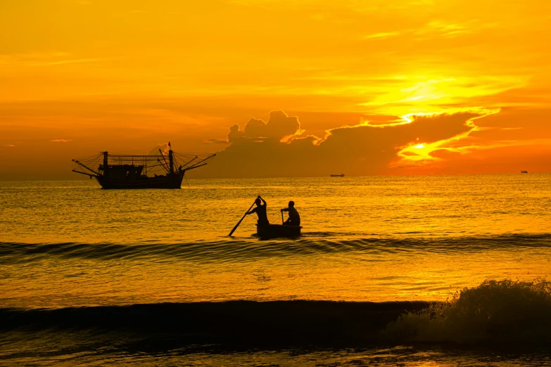 a couple of people riding on top of a boat in the ocean, by Andries Stock, pexels contest winner, golden hues, fishing boat, thumbnail, predawn