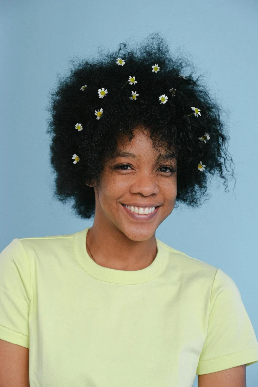 a woman with a bunch of flowers in her hair, natural hair, based on bumblebee, promo image, bedhead